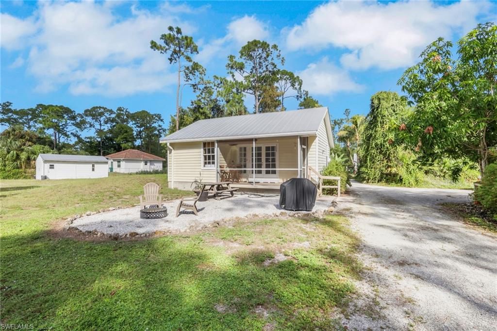 5092 Boxwood Way Naples, FL 34116 - Photo 33 of 48 Guest House Featuring Living & Dining Room, Full Kitchen, 1 Bedroom, 1 Bathroom, Washer/Dryer, Screened Patio Area, Carport, Firepit Area, Extra Parking with it's own private driveway. (Completely private from the main house)