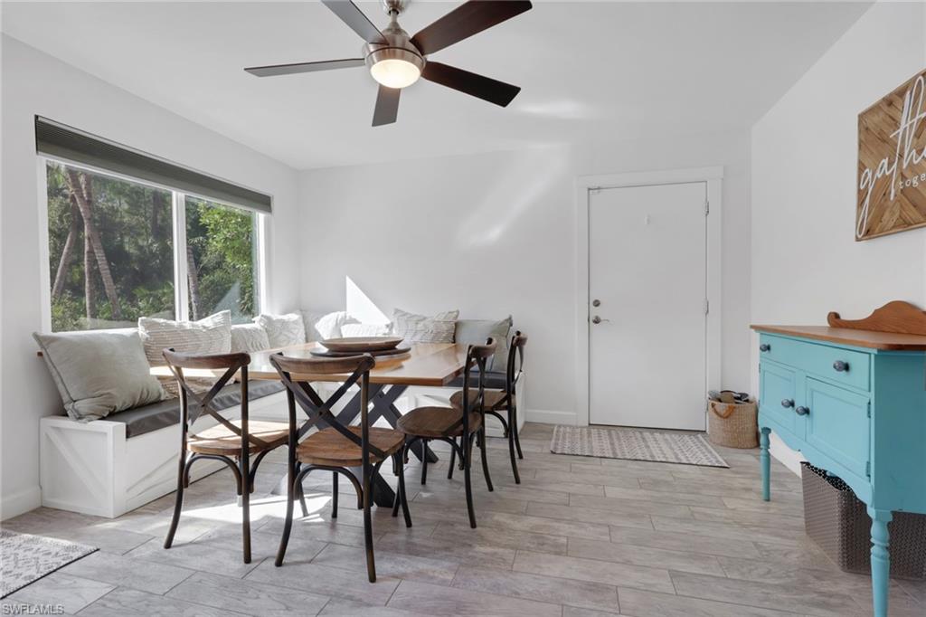 5092 Boxwood Way Naples, FL 34116 - Photo 5 of 48 Dining Area off the kitchen with tons of natural lighting and a beautiful view of the pool area, custom built seating that can also be used for added storage