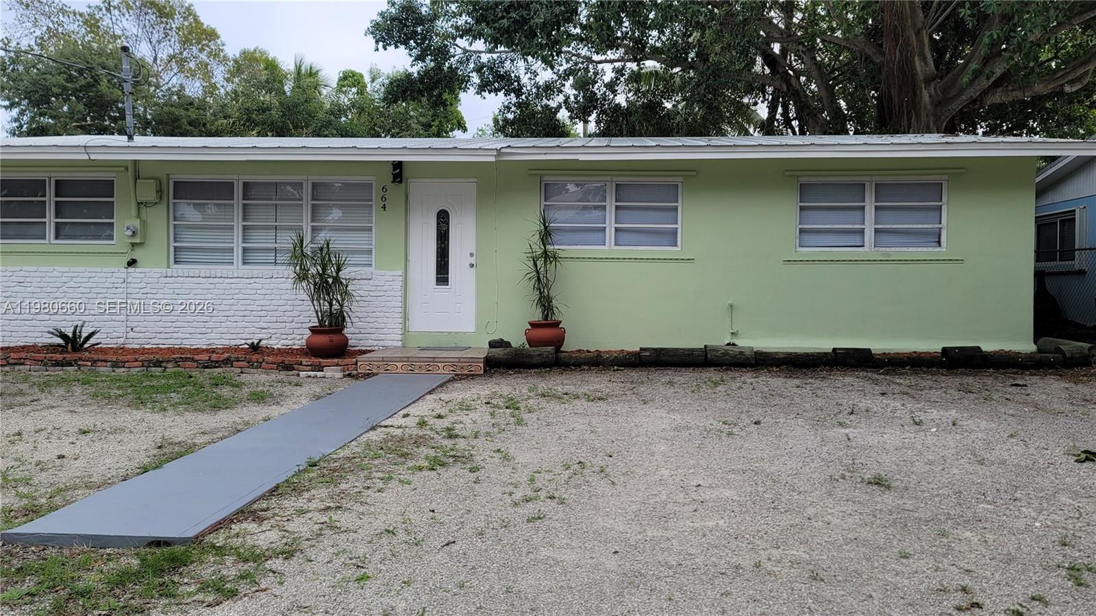 664 Colson Drive Key Largo, FL 33037 - Photo 1 of 23 a front view of a house