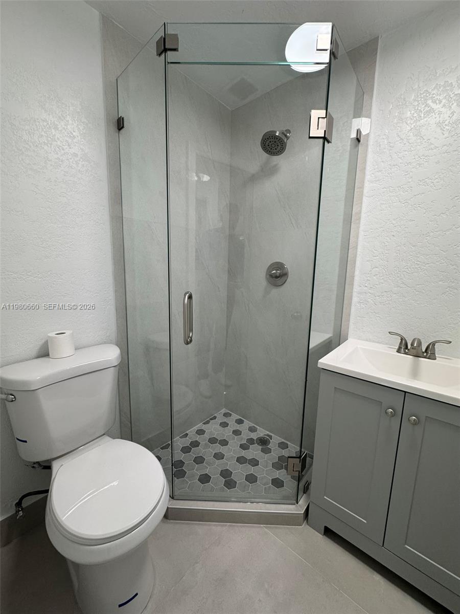 664 Colson Drive Key Largo, FL 33037 - Photo 13 of 23 a bathroom with a sink toilet and shower