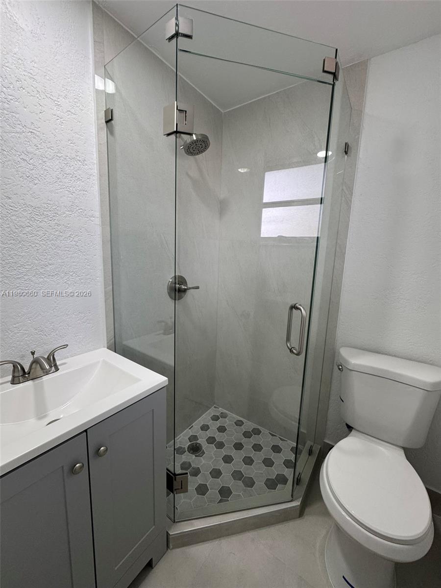 664 Colson Drive Key Largo, FL 33037 - Photo 14 of 23 a bathroom with a sink toilet and shower