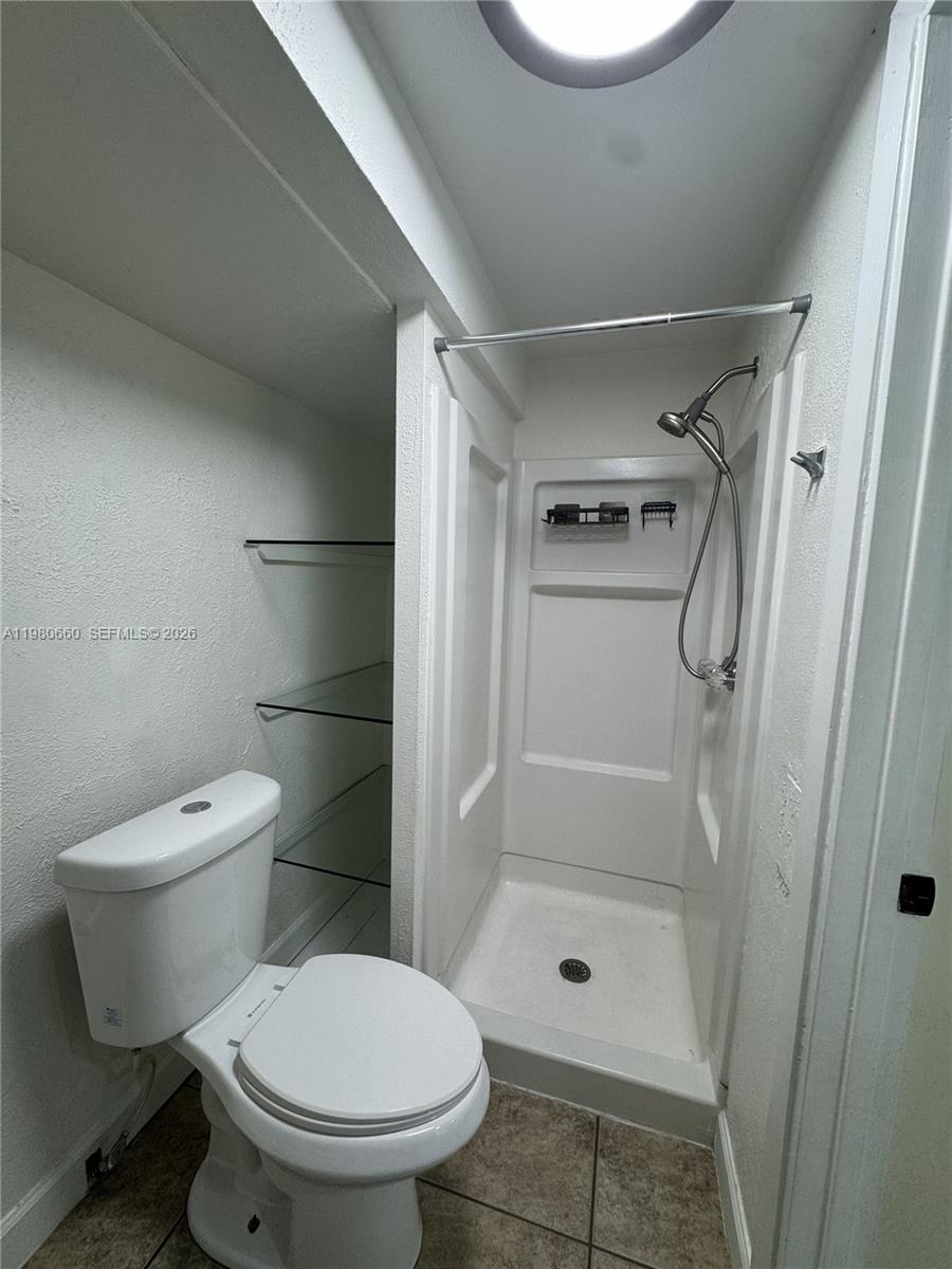 664 Colson Drive Key Largo, FL 33037 - Photo 21 of 23 a bathroom with a toilet and a shower