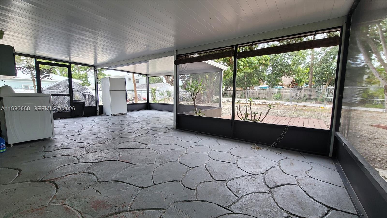 664 Colson Drive Key Largo, FL 33037 - Photo 4 of 23 a building outdoor space with a large window