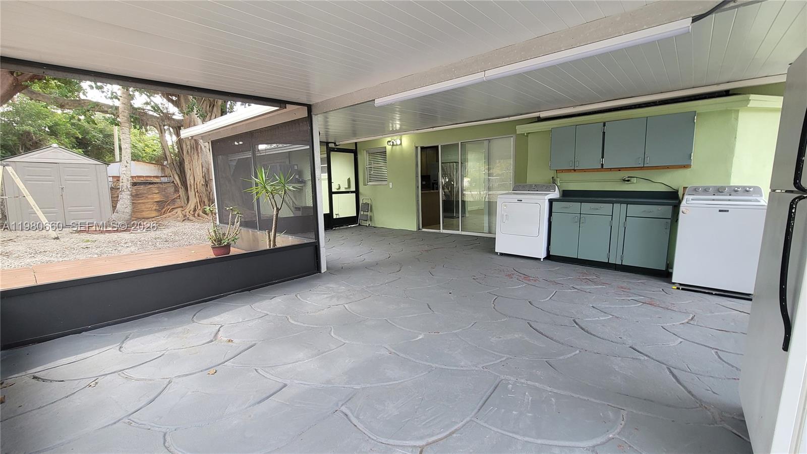 664 Colson Drive Key Largo, FL 33037 - Photo 5 of 23 a view of a kitchen with a sink and a large window