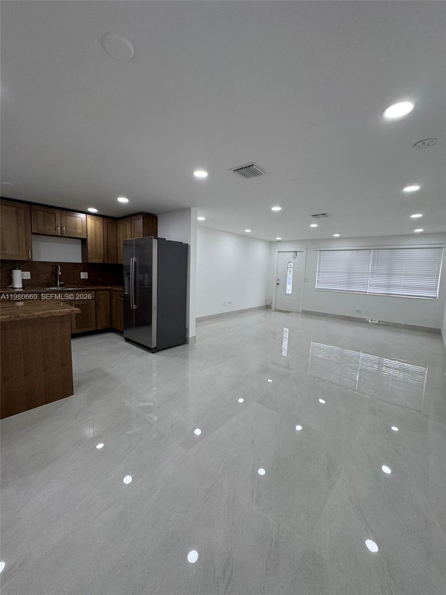 664 Colson Drive Key Largo, FL 33037 - Photo 10 of 23 a view of a kitchen with a refrigerator and a microwave