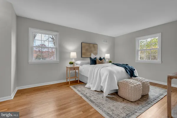 a bedroom with bed and window