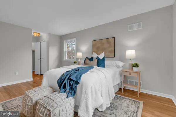 a bed room with a bed and a lamp