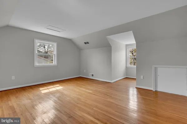 a view of room with wooden floor