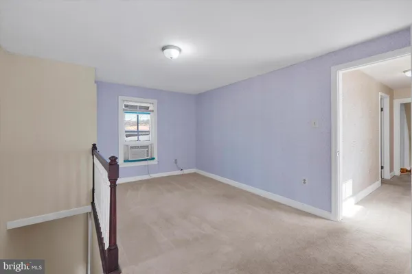 a view of a hallway with closet area