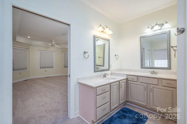 a spacious bathroom with a granite countertop sink a mirror and a