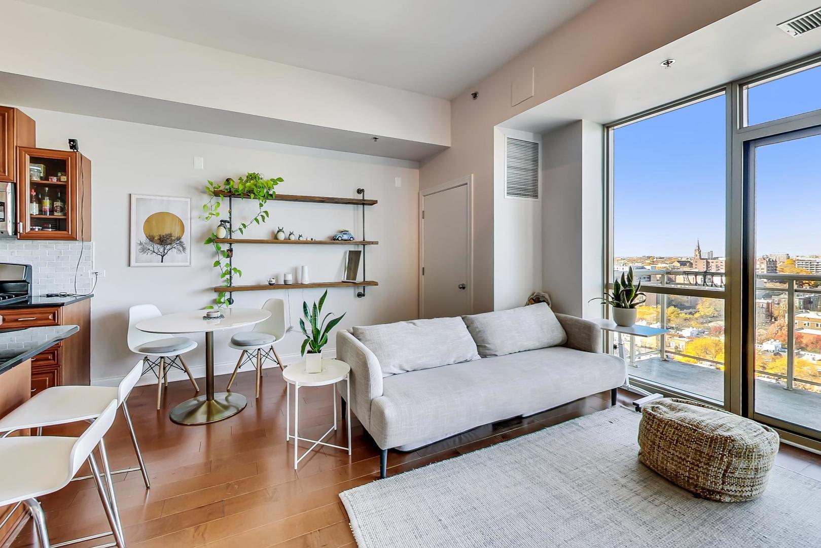 230 West Division Street, Unit 1307 Chicago, IL 60610 - Photo 5 of 33 a living room with furniture and a potted plant