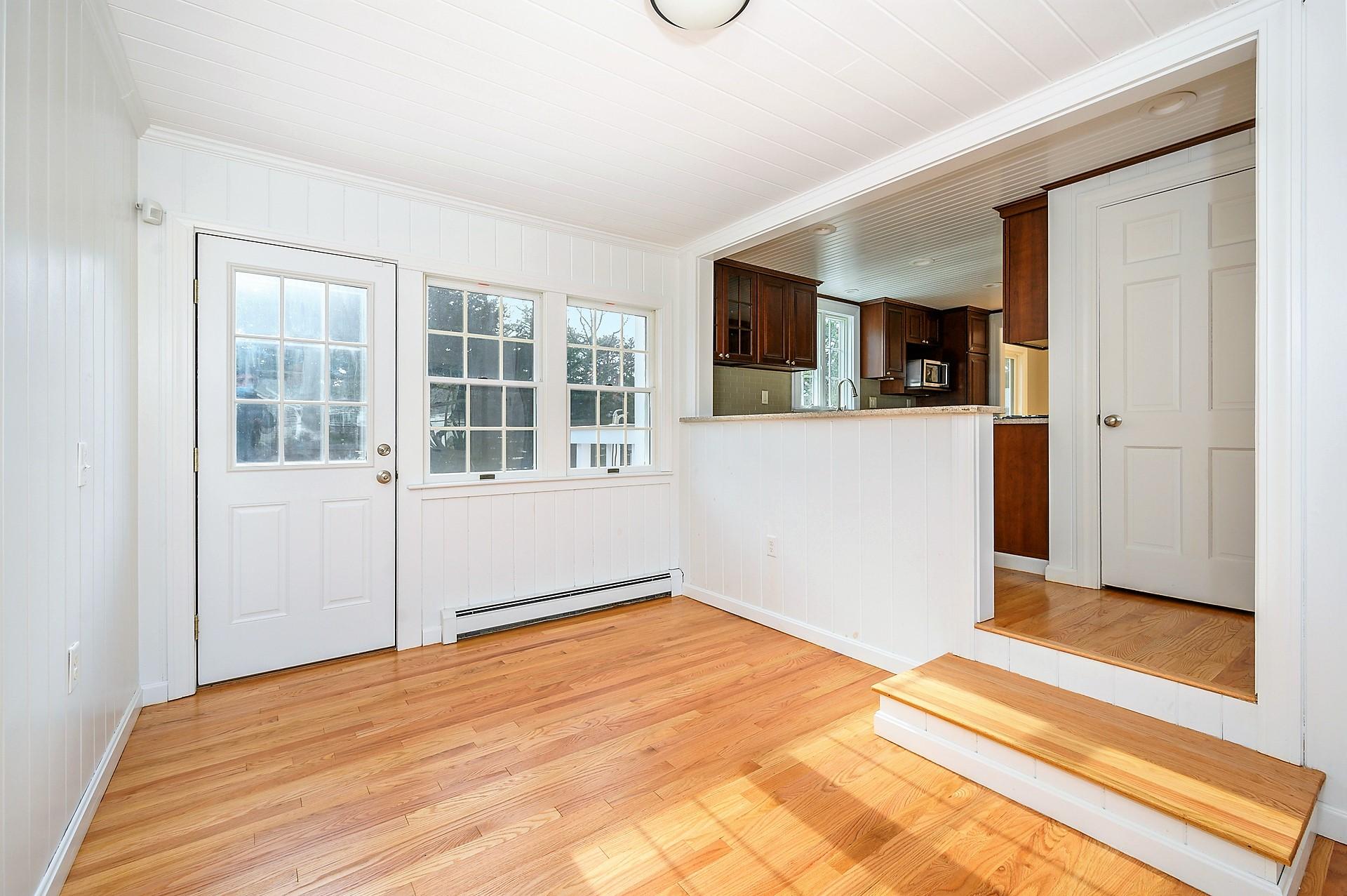 15 Captain Small Road South Yarmouth, MA 02664 - Photo 11 of 17 a view of empty room with a fireplace and wooden floor