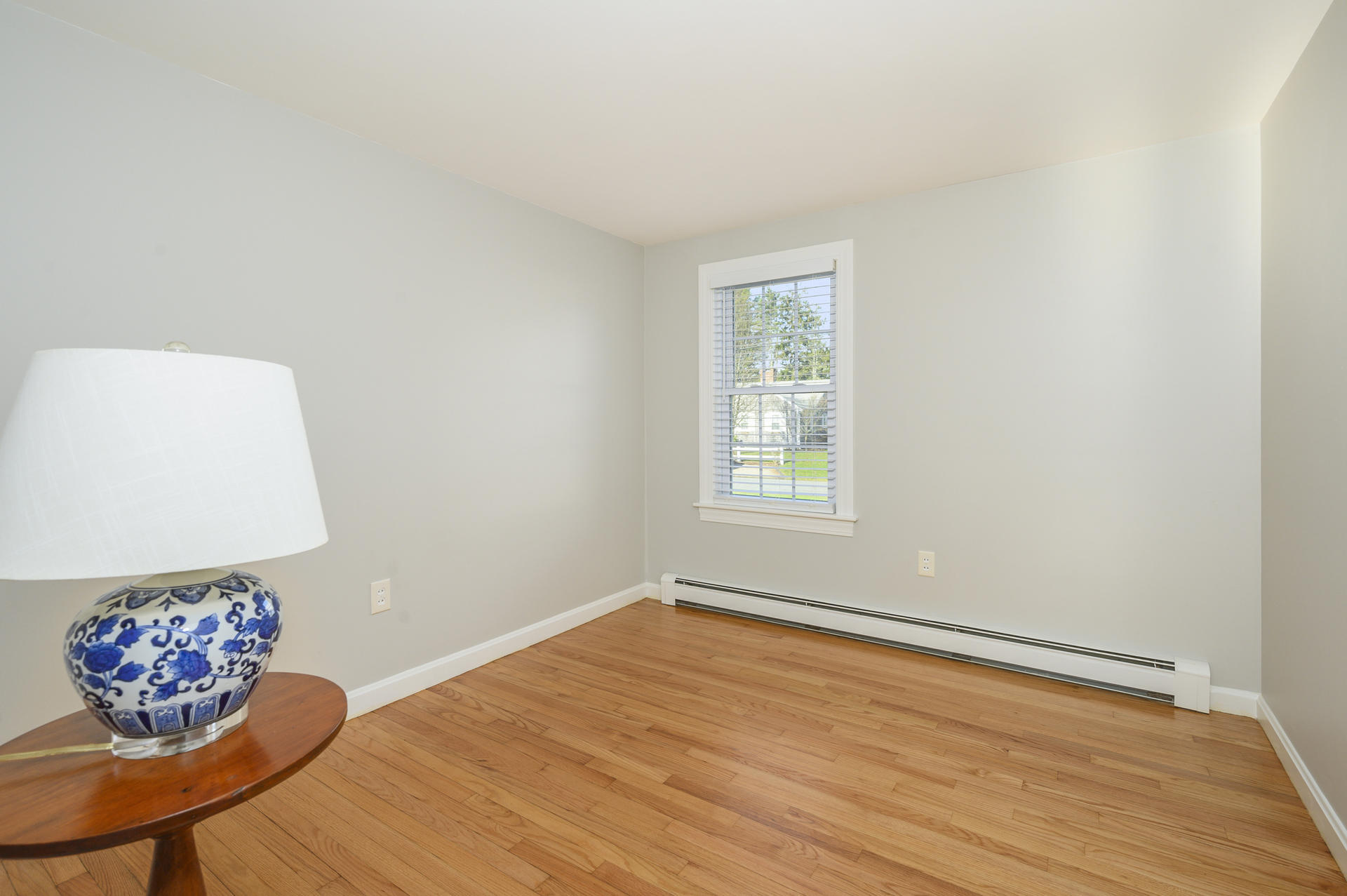 15 Captain Small Road South Yarmouth, MA 02664 - Photo 14 of 17 a view of an empty room with a window and wooden floor