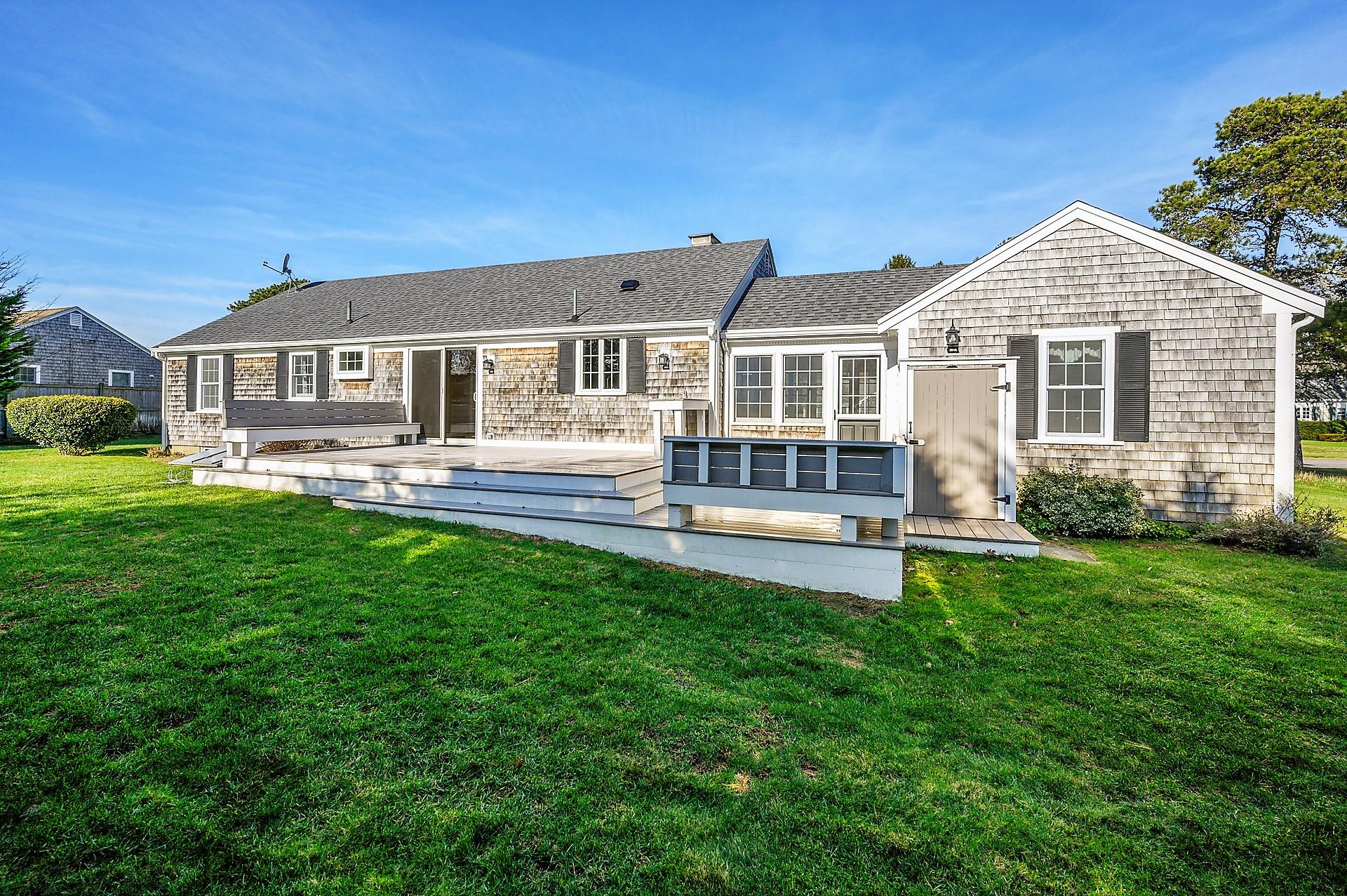 15 Captain Small Road South Yarmouth, MA 02664 - Photo 3 of 17 a front view of a house with a yard and trees