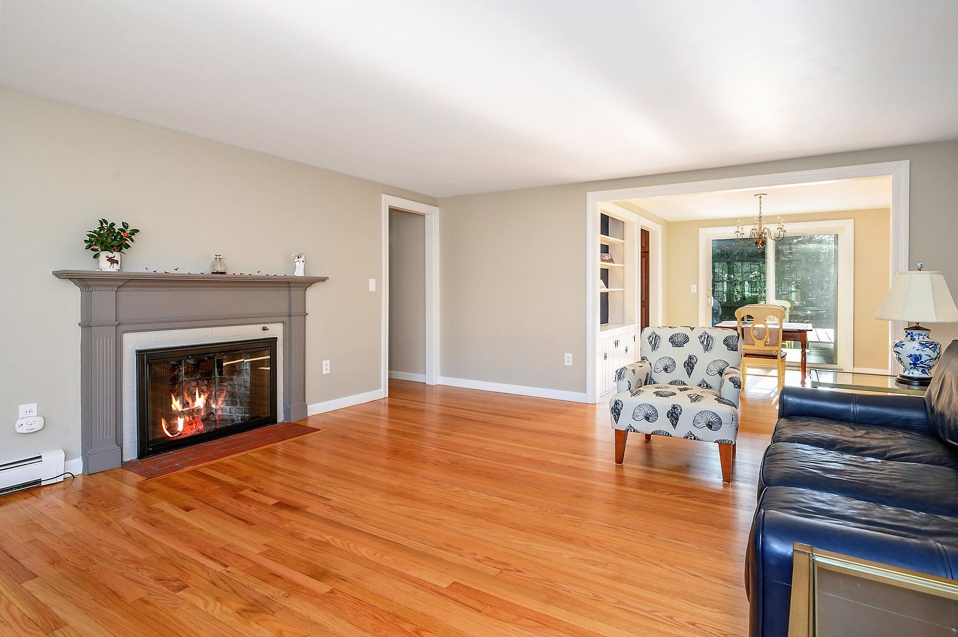 15 Captain Small Road South Yarmouth, MA 02664 - Photo 5 of 17 a living room with furniture and a fireplace