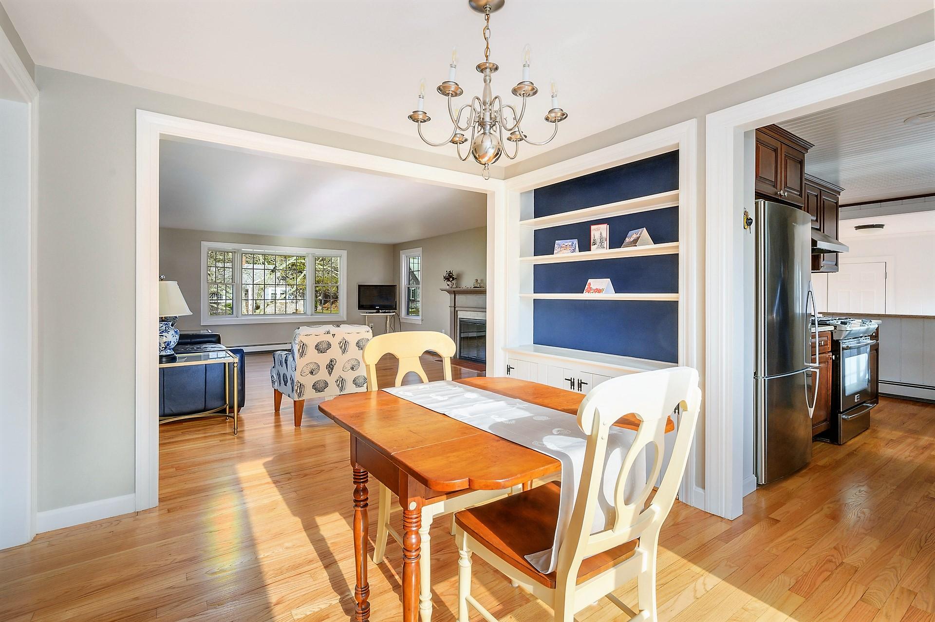 15 Captain Small Road South Yarmouth, MA 02664 - Photo 7 of 17 a view of a dining room with furniture and a chandelier