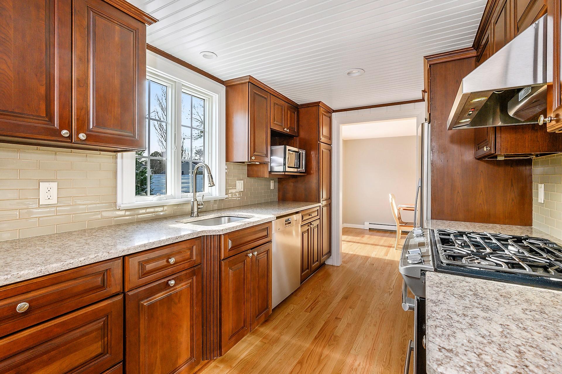 15 Captain Small Road South Yarmouth, MA 02664 - Photo 9 of 17 a kitchen with stainless steel appliances a sink stove and cabinets