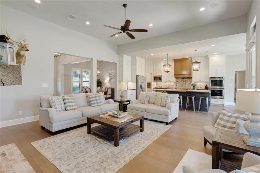 425 Ridgeview Road Sherman, TX 75092 - Photo 11 of 40 a living room with furniture and a wooden floor