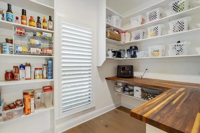 a kitchen with stainless steel appliances granite countertop a sink and a refrigerator