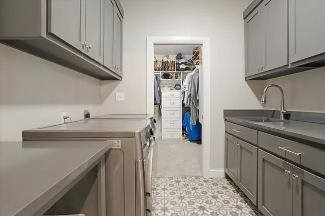 a kitchen with a sink and cabinets