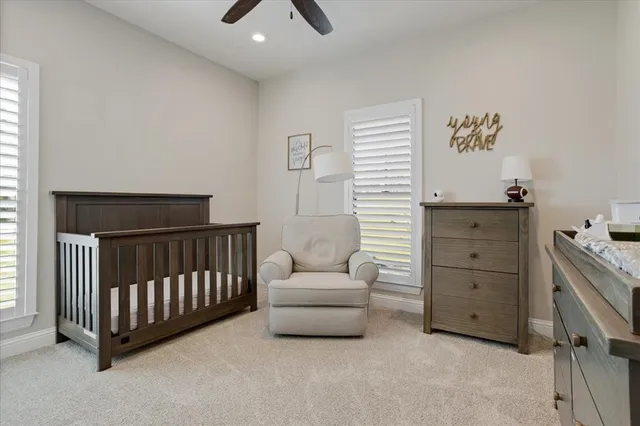 a bedroom with a bed and a couch