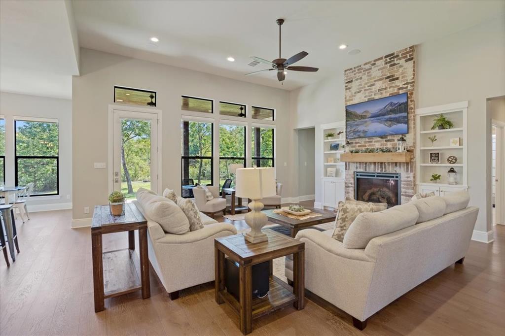 425 Ridgeview Road Sherman, TX 75092 - Photo 8 of 40 a living room with furniture fireplace and a large window