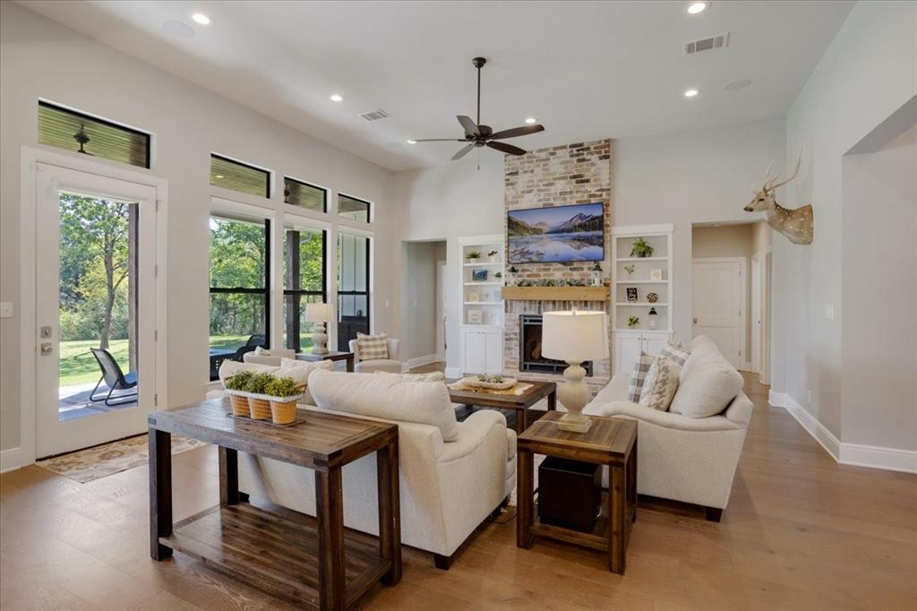 425 Ridgeview Road Sherman, TX 75092 - Photo 9 of 40 a living room with fireplace furniture and a large window