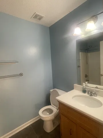 a bathroom with a sink and toilet