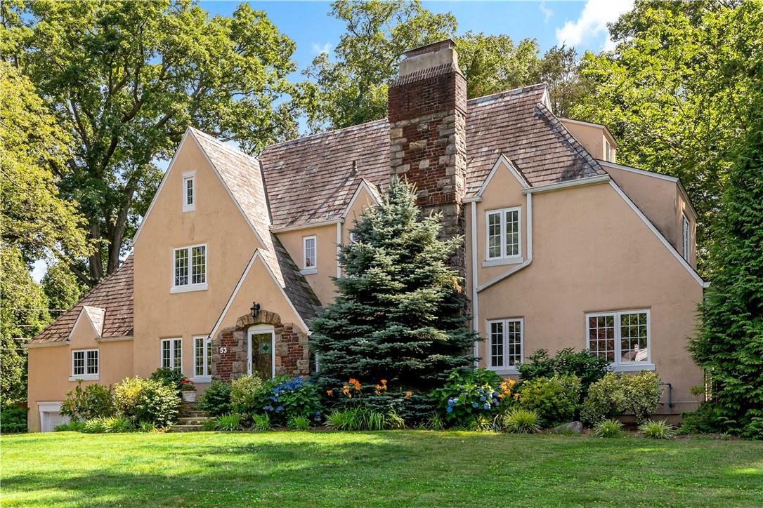 Welcome home to this picturesque classic and updated Greenacres gem perfectly sited on a manicured lush, level .30 acres