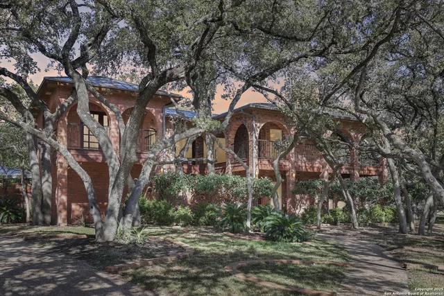 a big house with large trees