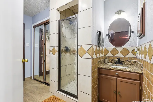 a bathroom with a sink and a mirror