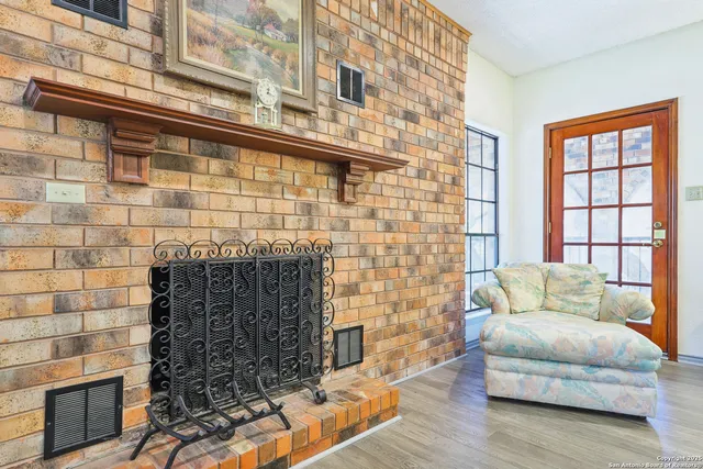 a living room with furniture windows and a fireplace