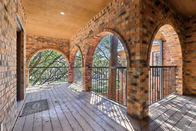 a view of a garden from a balcony