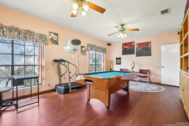 a living room with furniture a rug and a chandelier