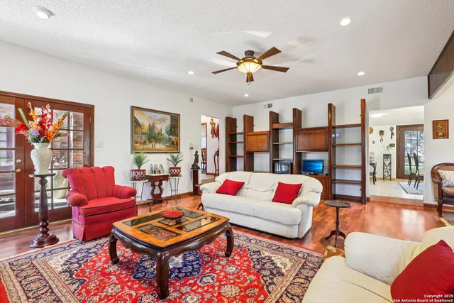 a living room with furniture and a rug
