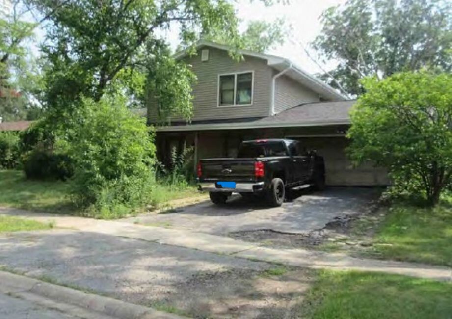 704 North Pinecrest Road Bolingbrook, IL 60440 - Photo 3 of 3 a view of a car in front of house