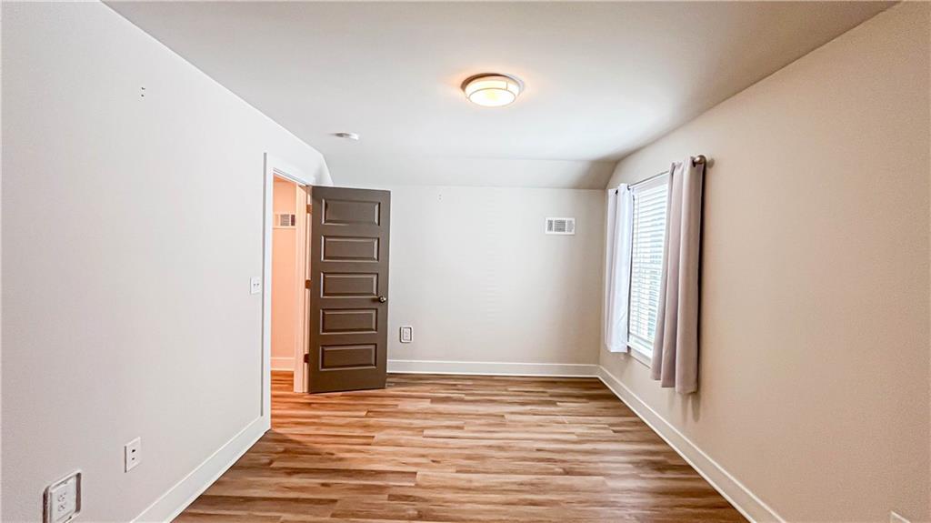 740 Eudora Welty Way Athens, GA 30607 - Photo 52 of 57 a view of a hallway with wooden floor and staircase