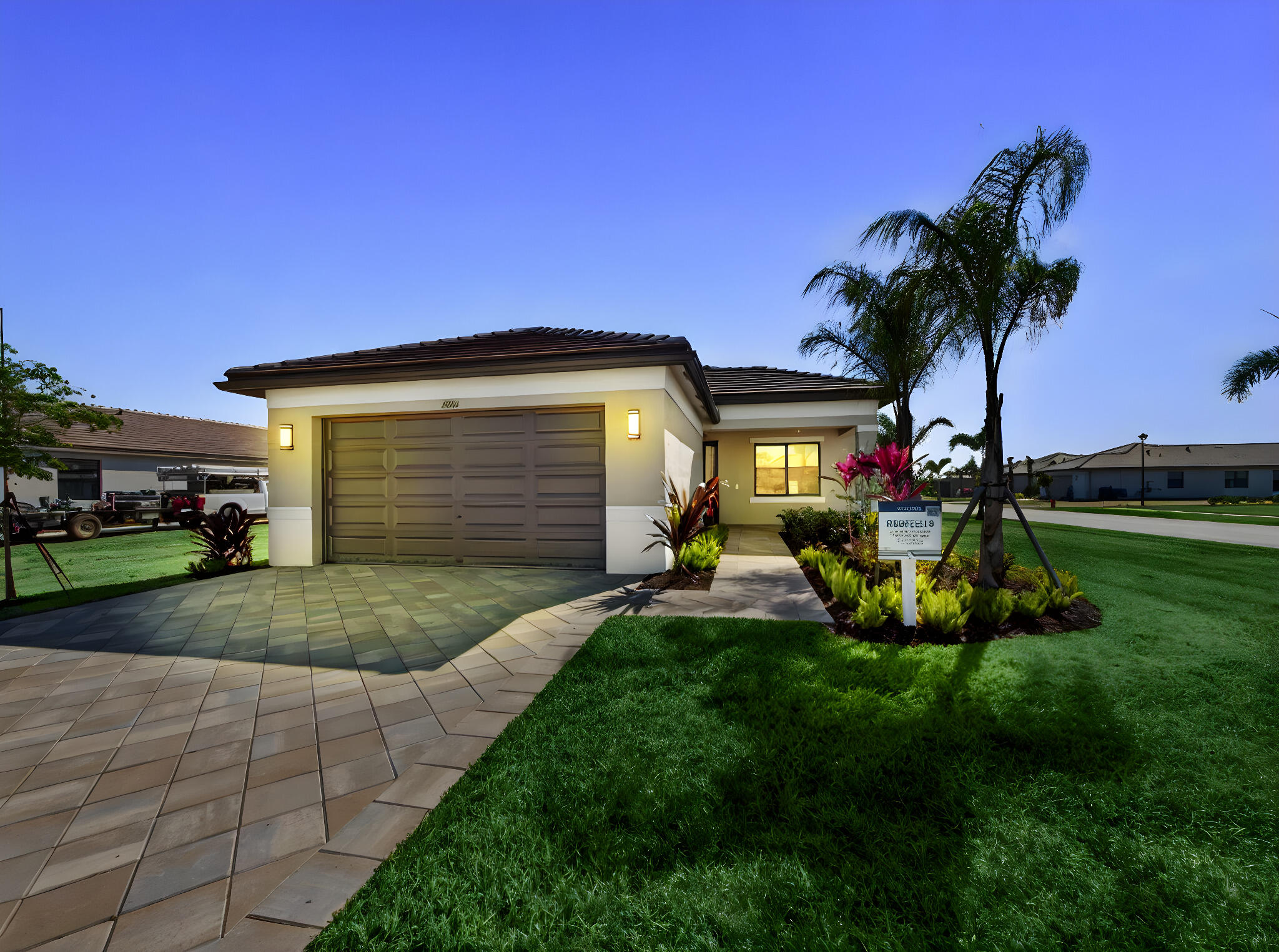 12406 Southwest High Tide Road Port St. Lucie, FL 34987 - Photo 1 of 60 Front Exterior Night Shot