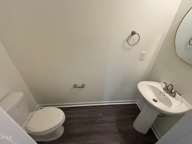 a bathroom with a toilet and a sink