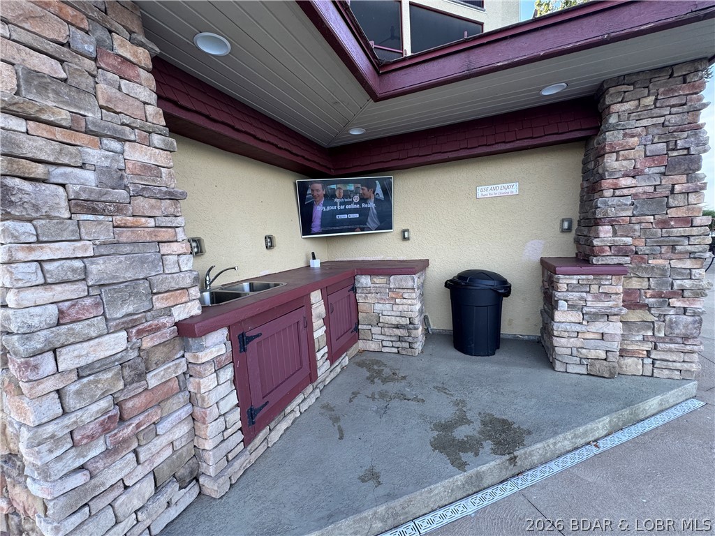 3168 Twin Rivers Point, Unit 2B Camdenton, MO 65020 - Photo 66 of 92 Poolside Bar Area w/ Large Screen TV to Keep an Ey