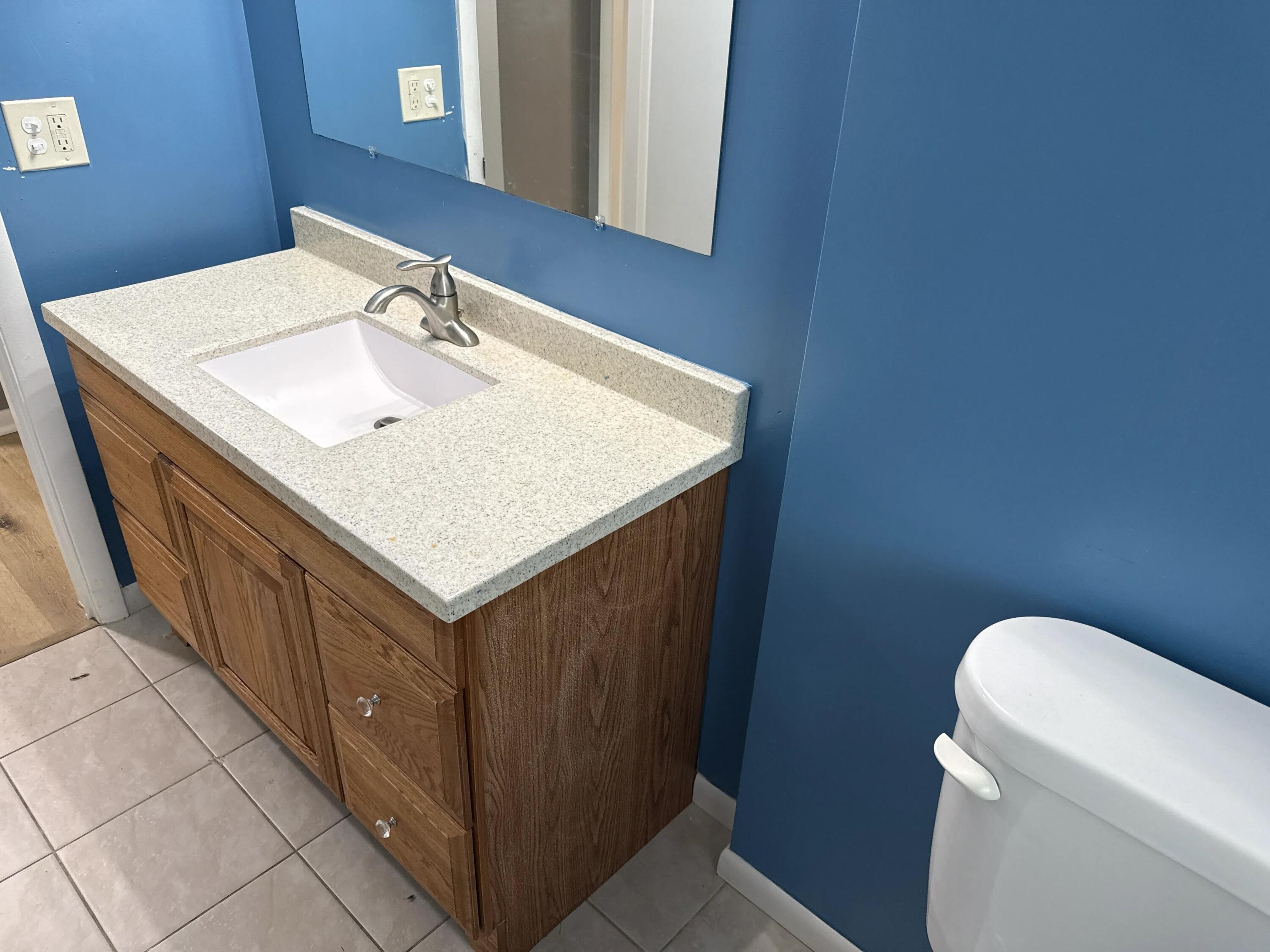 3800 Lasalle Street Racine, WI 53402 - Photo 39 of 74 Ceramic tile floor and handicap accessible shower with grab bars