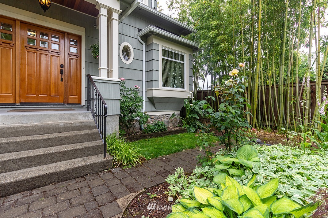 8320 Renton Avenue South Seattle, WA 98118 - Photo 2 of 39 a front view of a house with a garden