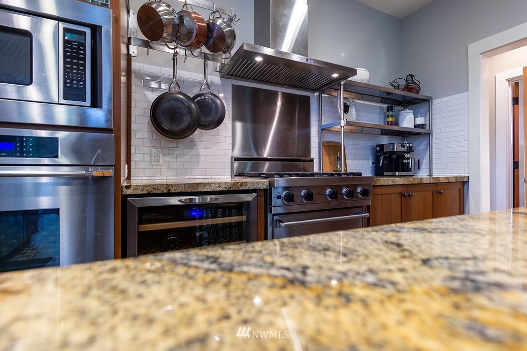 8320 Renton Avenue South Seattle, WA 98118 - Photo 11 of 39 a kitchen with stainless steel appliances a stove and a refrigerator