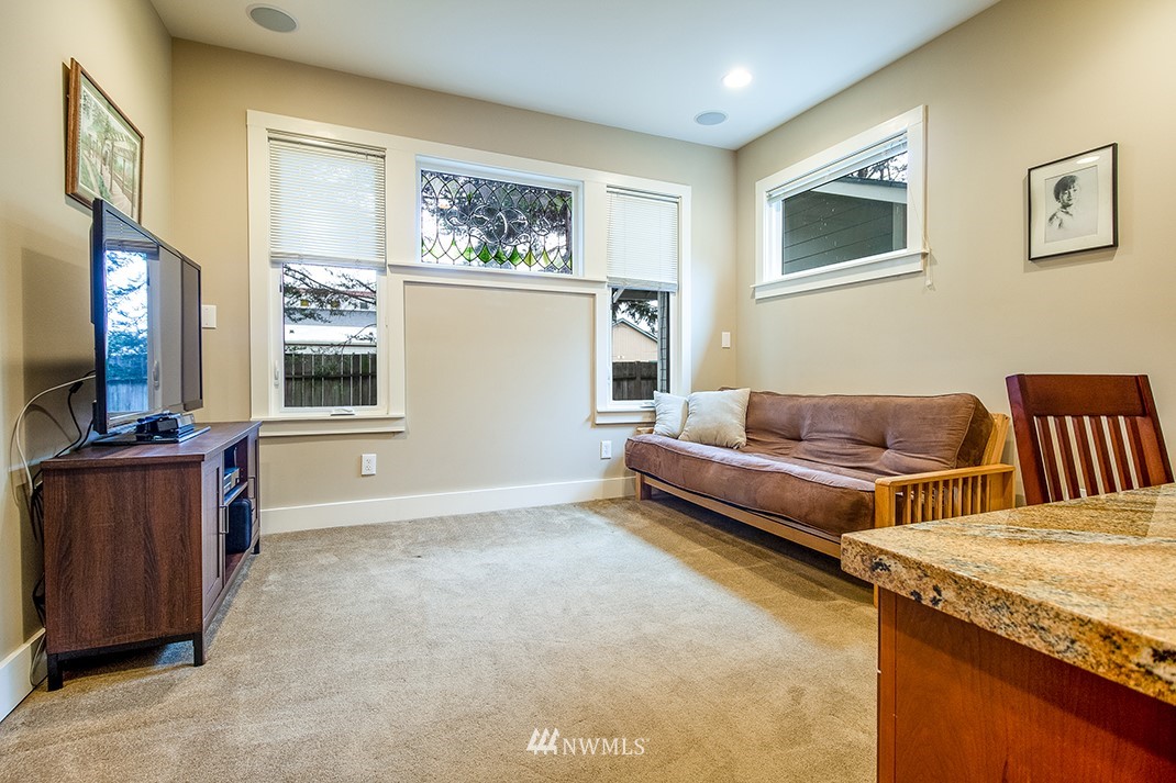 8320 Renton Avenue South Seattle, WA 98118 - Photo 12 of 39 a living room with furniture and a flat screen tv