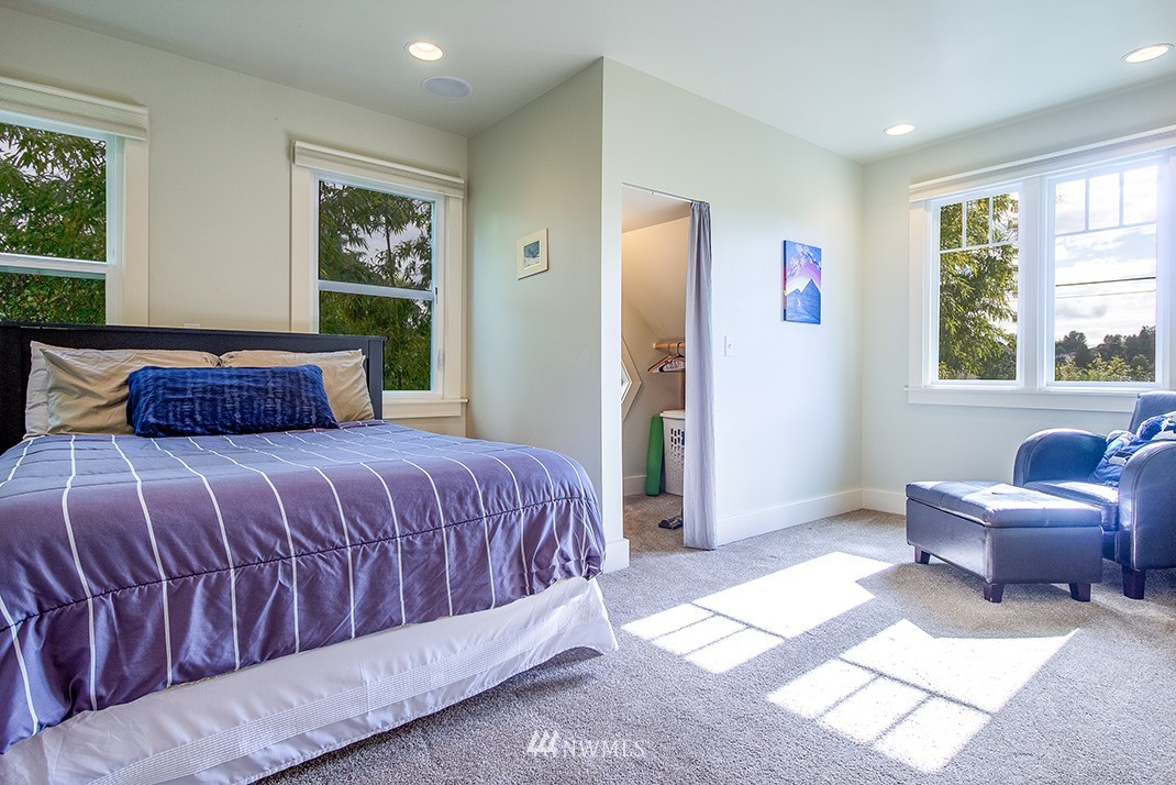 8320 Renton Avenue South Seattle, WA 98118 - Photo 19 of 39 a bedroom with a large bed couch and a window