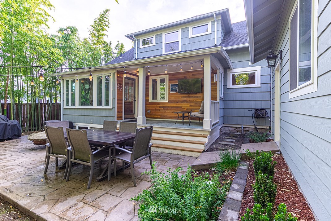 8320 Renton Avenue South Seattle, WA 98118 - Photo 31 of 39 a view of a house with a table and chair in the patio