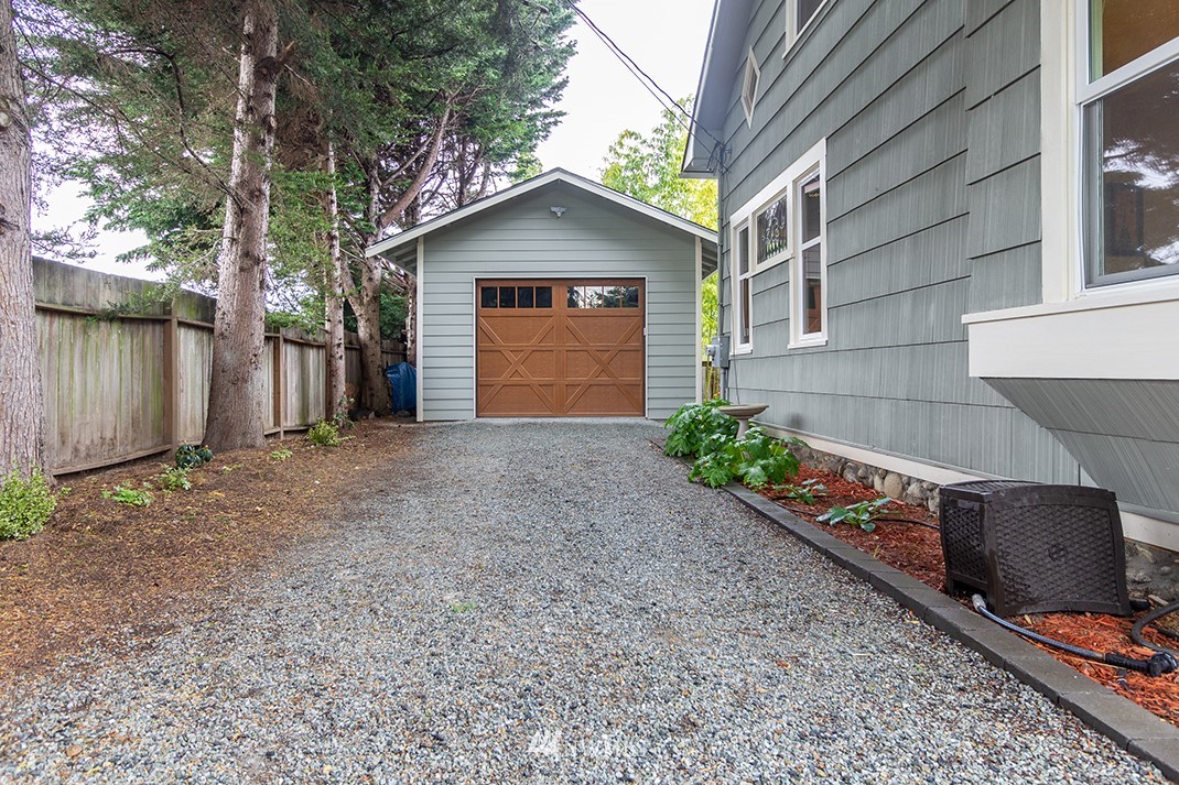 8320 Renton Avenue South Seattle, WA 98118 - Photo 33 of 39 a front view of a house with a yard and garage