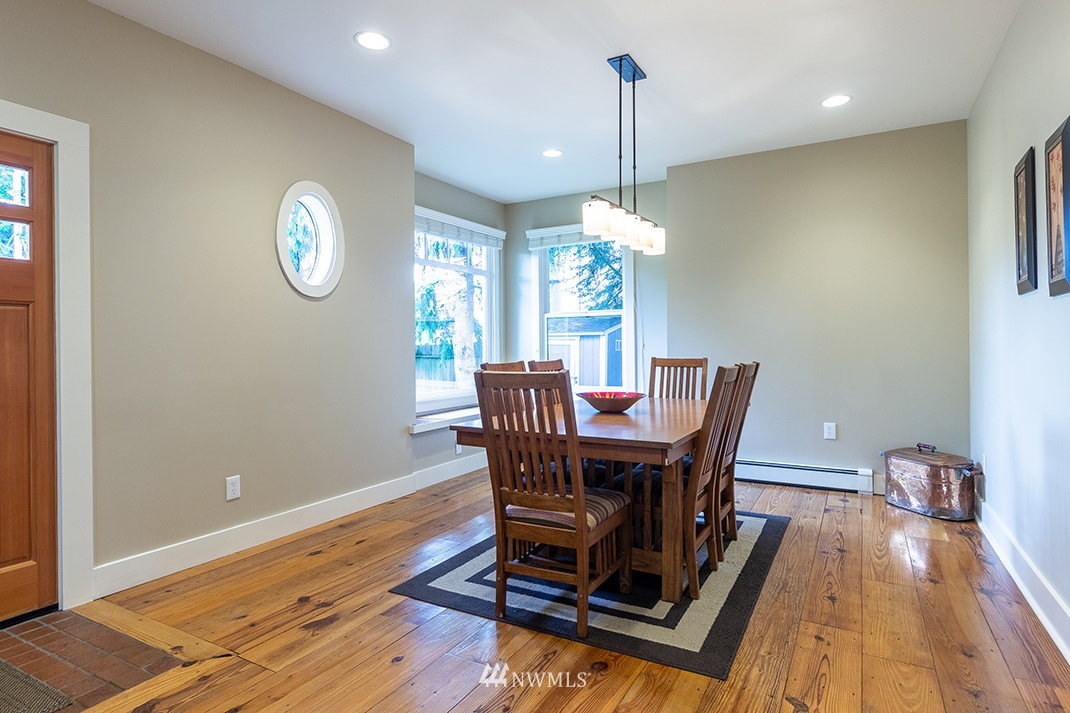 8320 Renton Avenue South Seattle, WA 98118 - Photo 7 of 39 a view of a dining room with furniture a chandelier and wooden floor