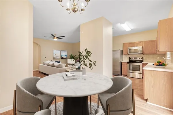 a view of kitchen with dining table and chairs