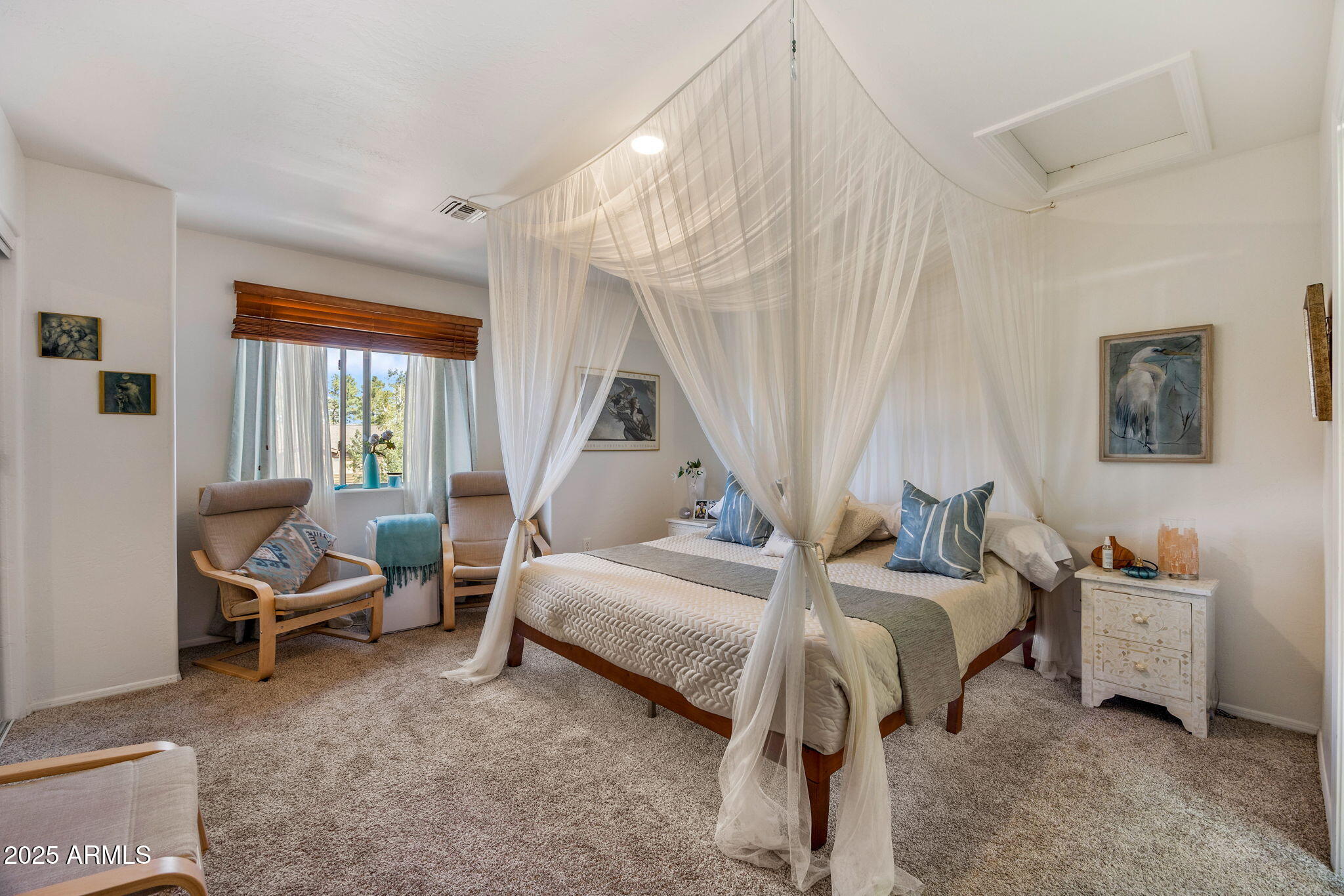 6935 Starlight Ridge Road Lakeside, AZ 85929 - Photo 12 of 33 a bedroom with a bed and a window
